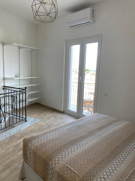 A bed or beds in a room at La fortezza