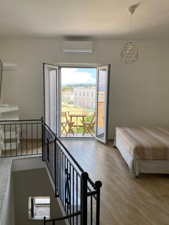 A bed or beds in a room at La fortezza