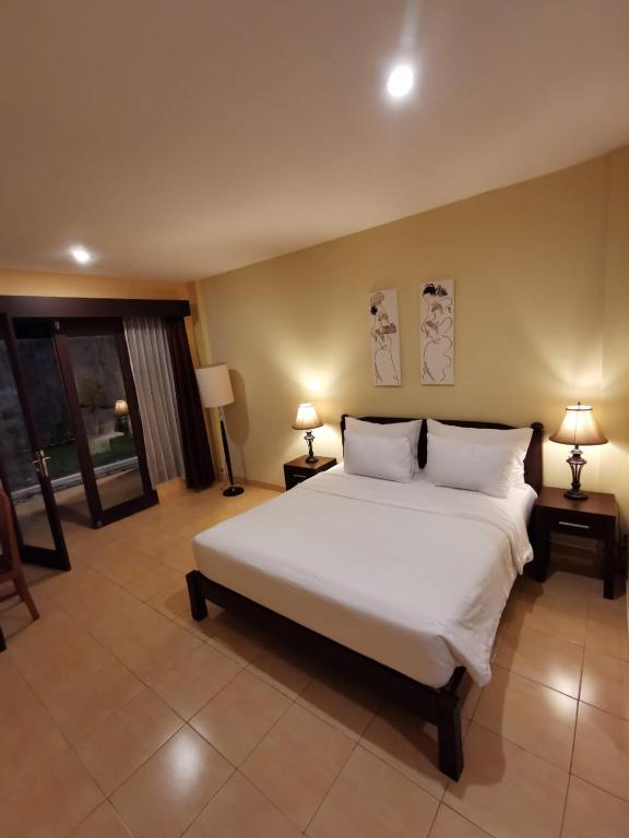 Postel nebo postele na pokoji v ubytování Dalia Budget Hotel