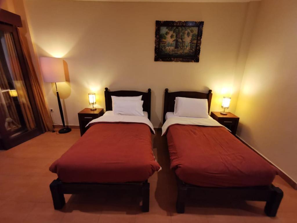 Postel nebo postele na pokoji v ubytování Dalia Budget Hotel