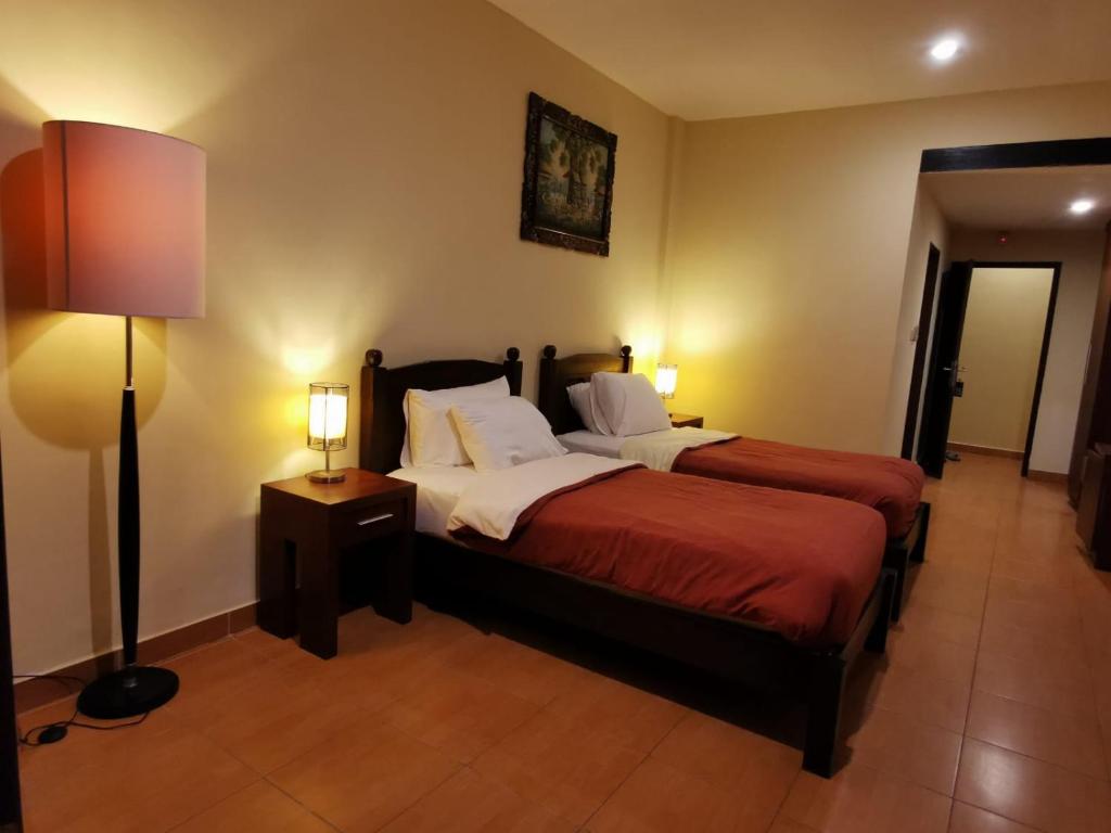 Postel nebo postele na pokoji v ubytování Dalia Budget Hotel
