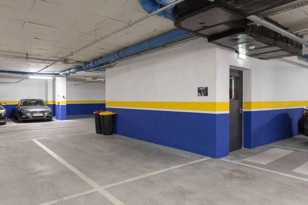 a parking garage with two cars parked in it at Lux oasis with private parking in Zagreb