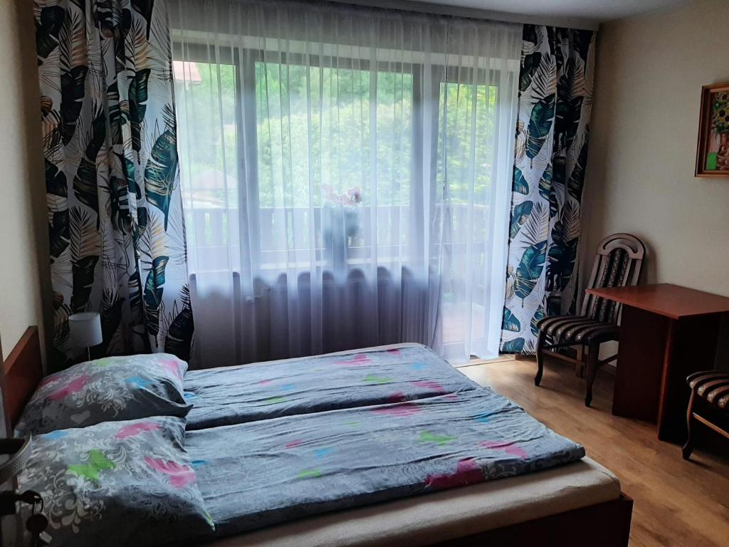 Postel nebo postele na pokoji v ubytování Pokoje Gościnne Alicja