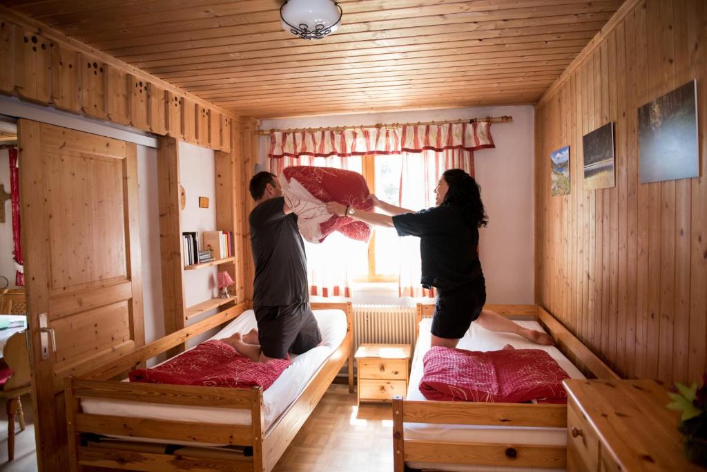 Postel nebo postele na pokoji v ubytování Katschwaldhütte