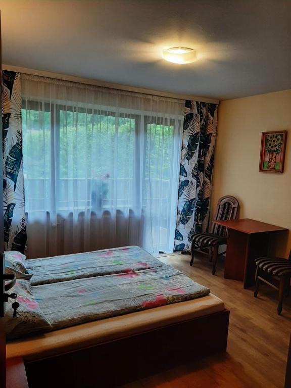 Postel nebo postele na pokoji v ubytování Pokoje Gościnne Alicja