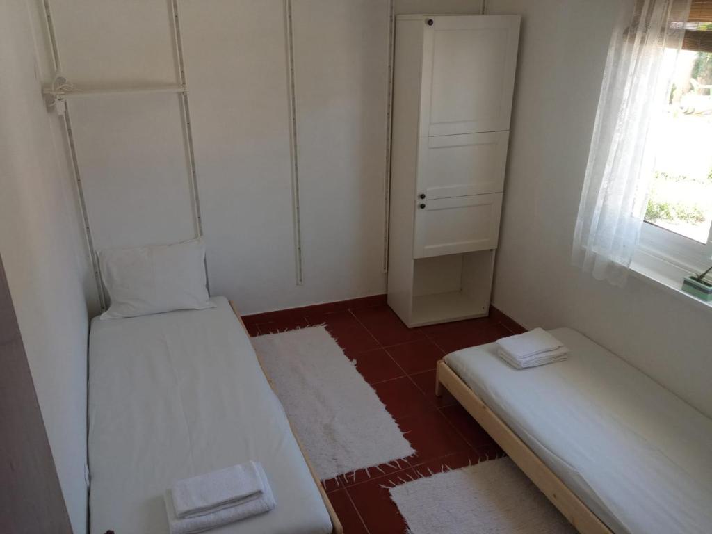Postel nebo postele na pokoji v ubytování Caparica Holidays