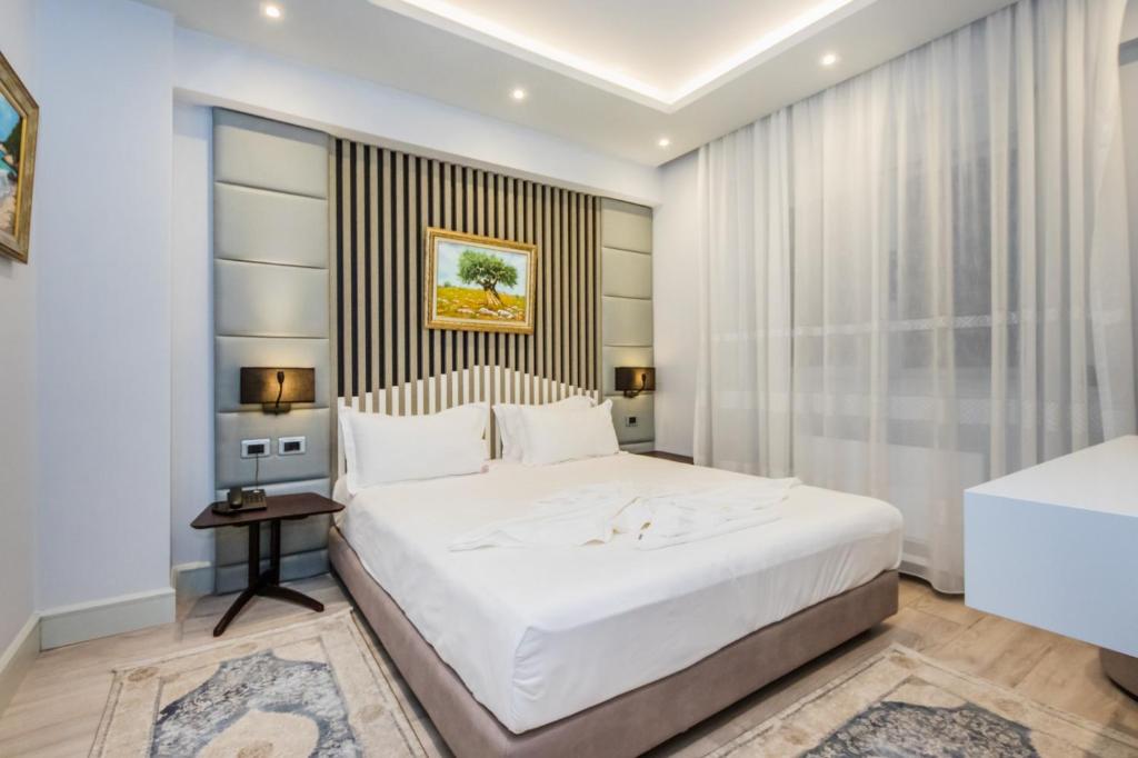 Postel nebo postele na pokoji v ubytování Hotel IMPERIAL