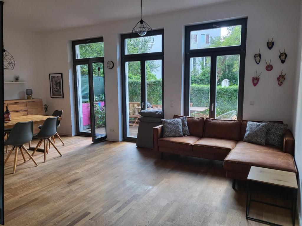 a living room with a couch and a table at Helenas place in Berlin