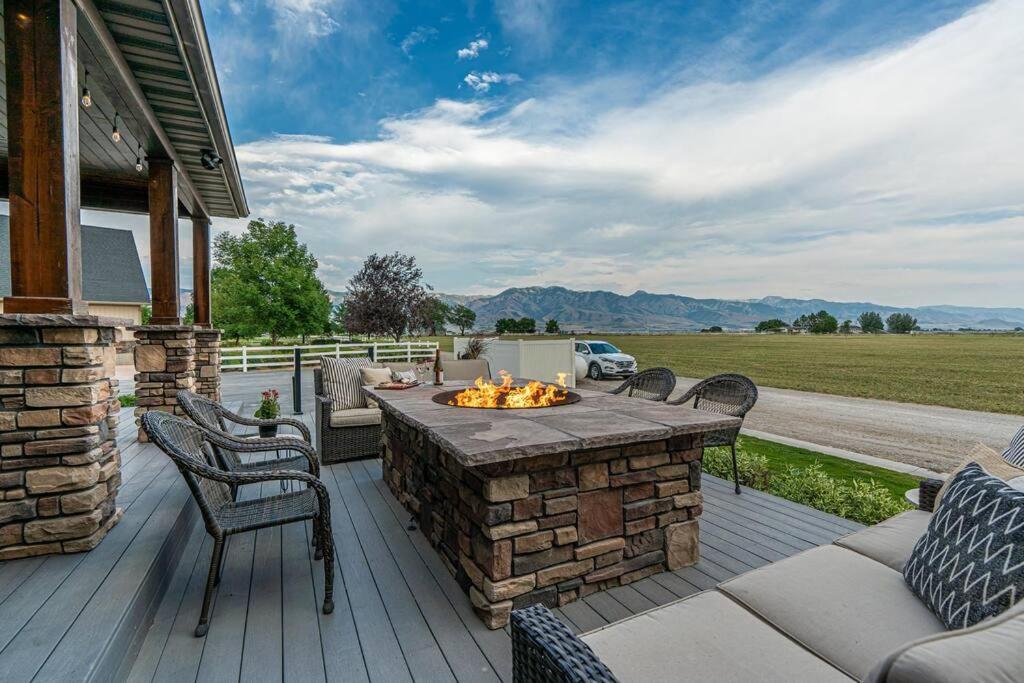 a patio with a fire pit on a house at Hemsley Ranch Guesthouse in Preston
