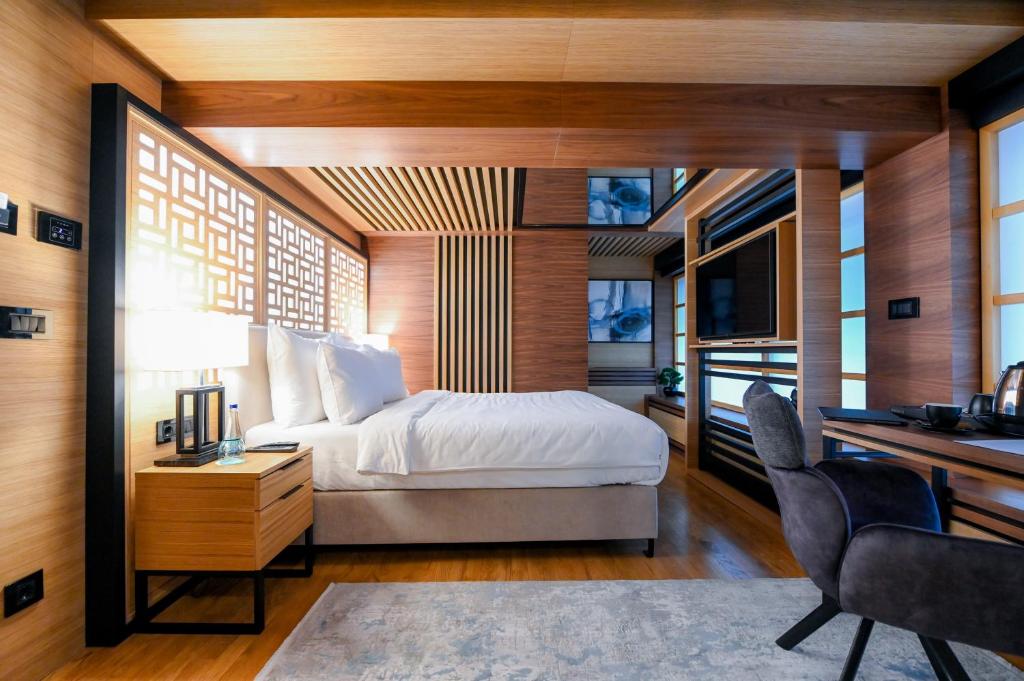Postel nebo postele na pokoji v ubytování Hanami Design Hotel