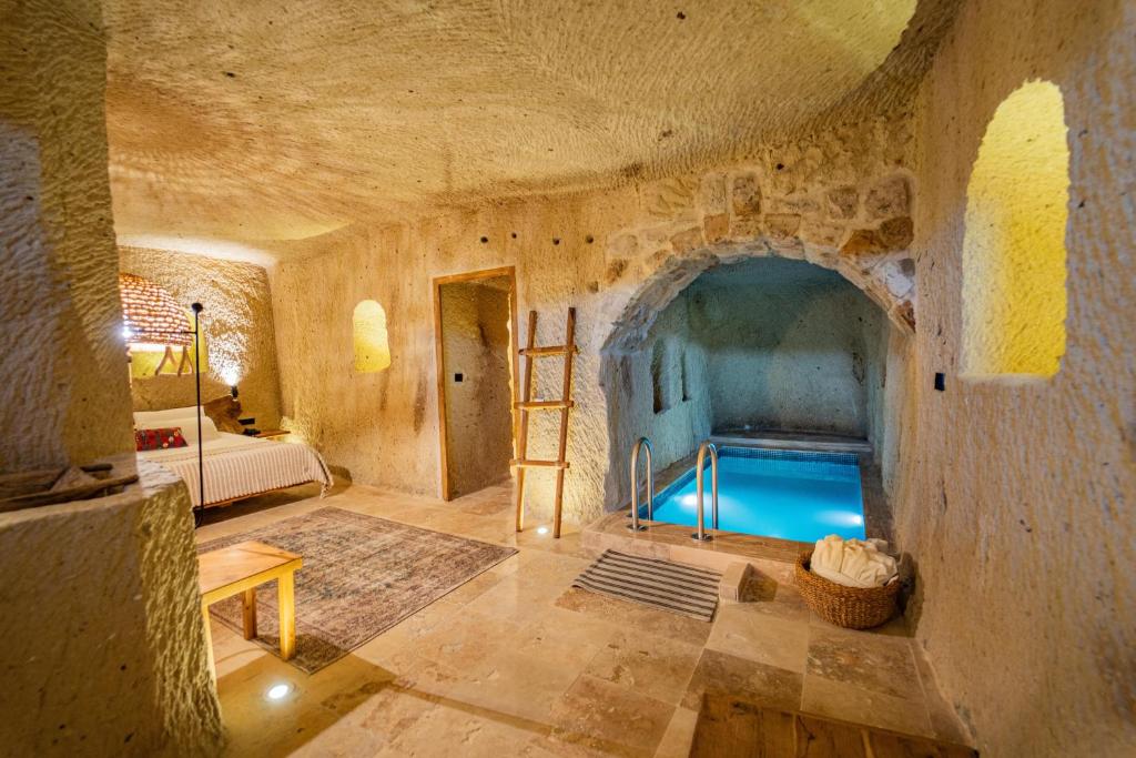 a room with a pool in the middle of a building at Vie Cappadocia - Adults Only in Nevsehir