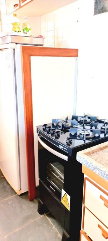 A cozinha ou cozinha compacta de Apartamento Ubatuba Terraços da Prainha Vista Mar