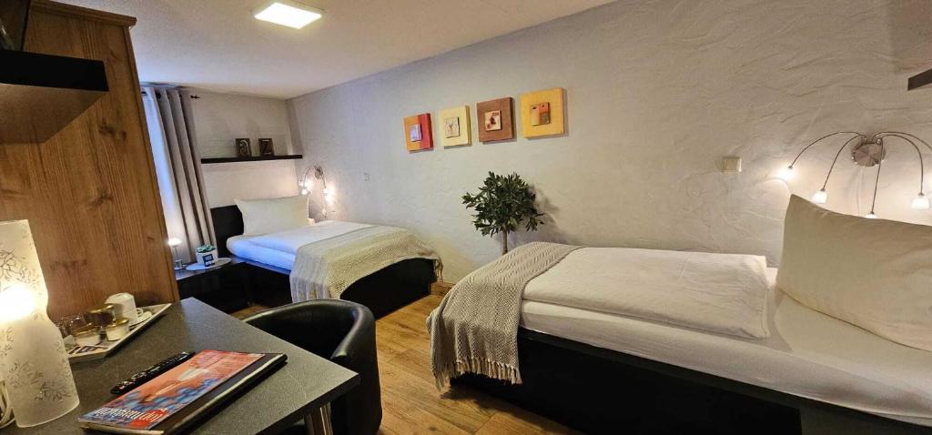 Postel nebo postele na pokoji v ubytování Hotelbetriebe Güldenhaupt GmbH