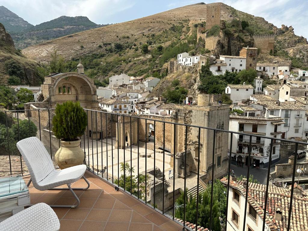 a balcony with a view of a city at Alojamientos Peña del Rey in Cazorla