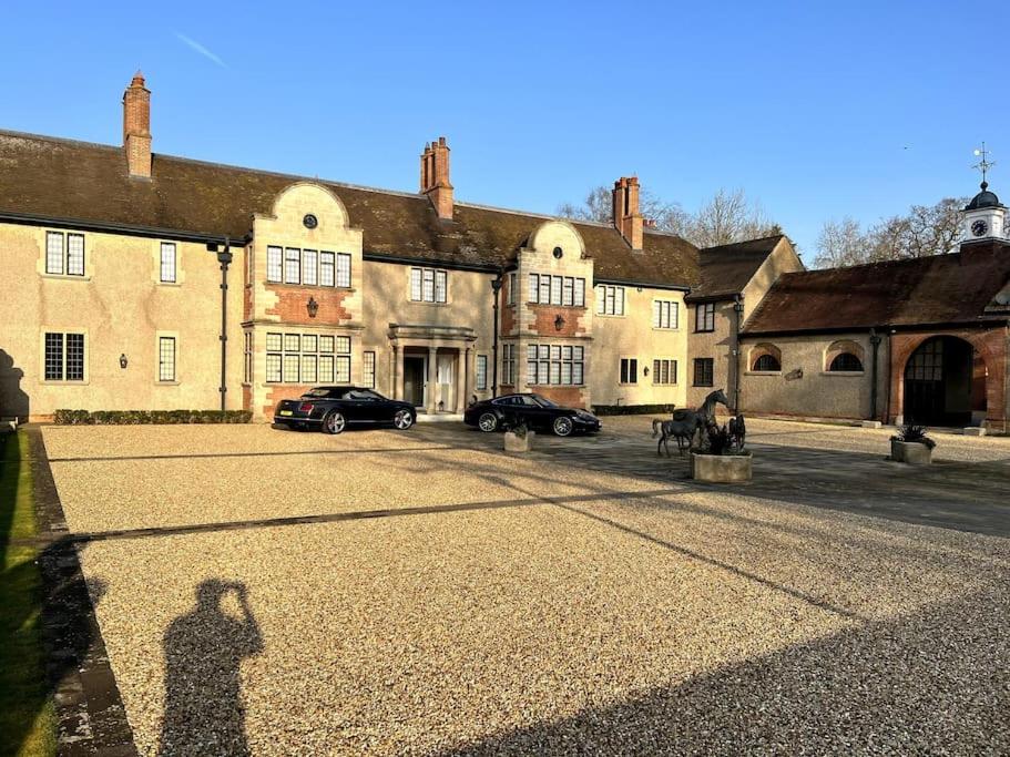 a shadow of a person standing in front of a building at 3 Bed Apartment Sleeps 6 Country House in Warwick in Warwick