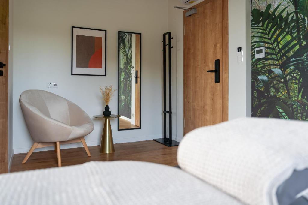 Postel nebo postele na pokoji v ubytování APARTHOTEL KLEOSIN