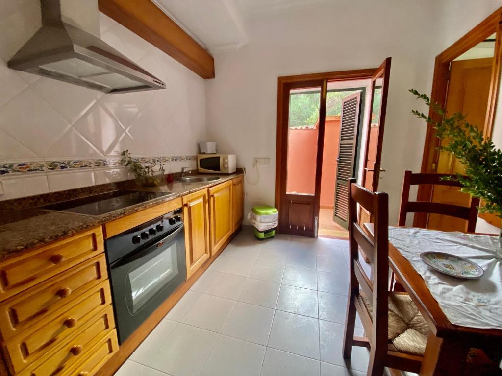 A kitchen or kitchenette at Rural Charm villa and Outdoor Adventure Agritourism Apartment with Private Mountain Path approximately 5 minutes walking from the beach Ideal for relaxation