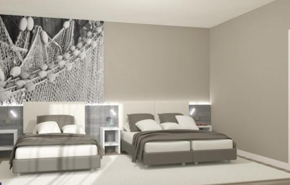 a bedroom with two beds at Hotel Lux in Caorle