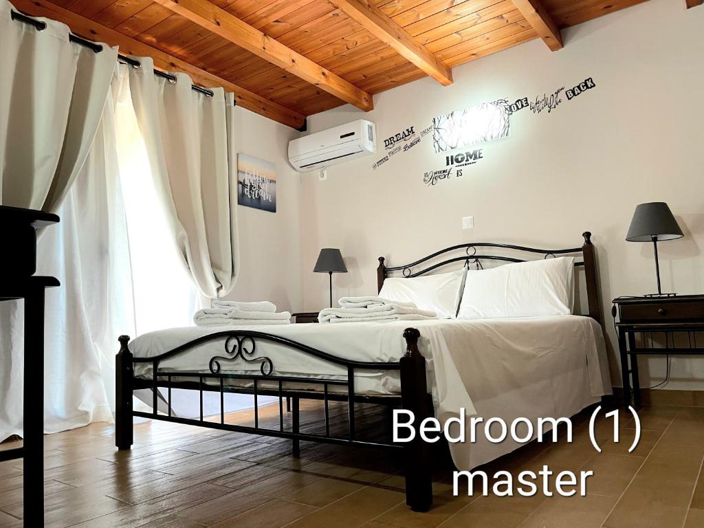 a bedroom with a bed in a room at Villa MARGIANI in Chalkida