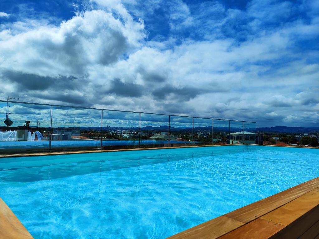 a large swimming pool on top of a building at Wally Residence in Rimini