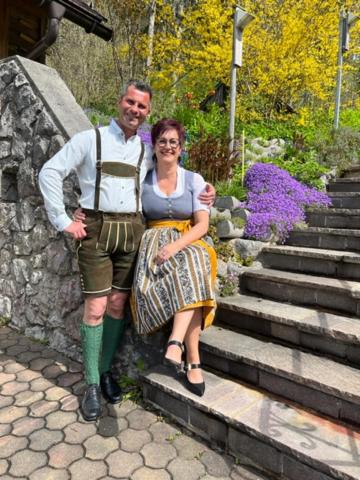 a man and a woman standing on some stairs at Haus Ranner in Bad Mitterndorf