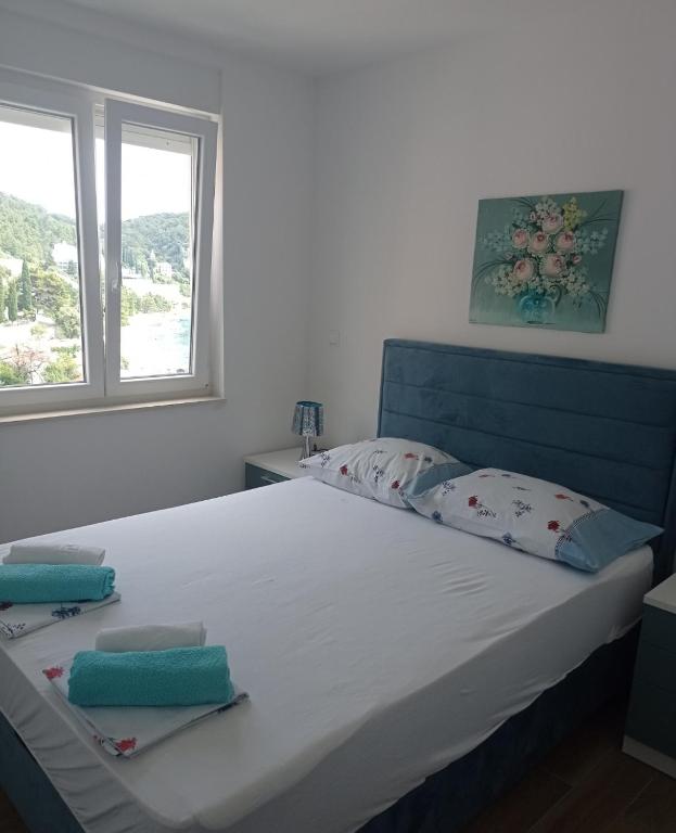 Postel nebo postele na pokoji v ubytování Apartman Nimfa Živogošće