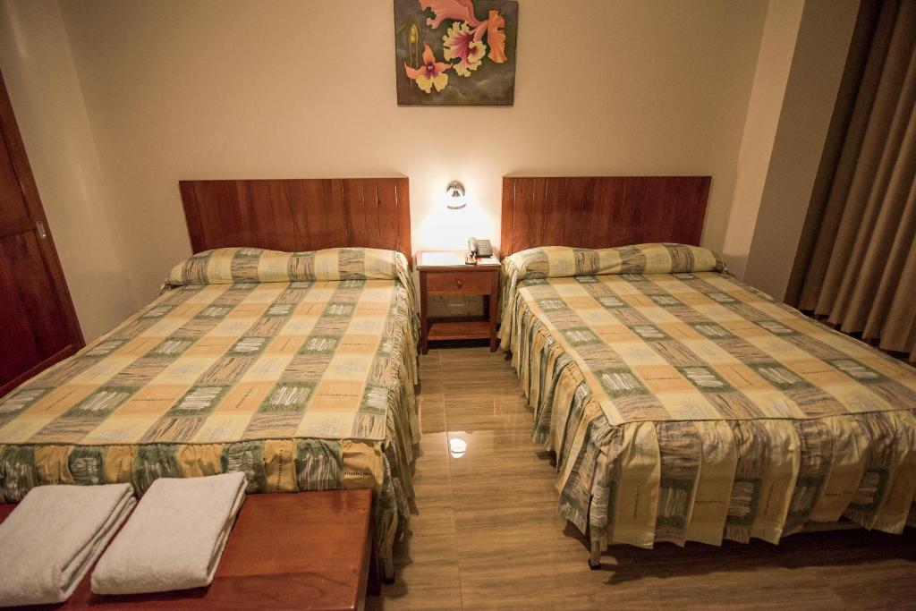 Postel nebo postele na pokoji v ubytování Amazonia Siu Hostal