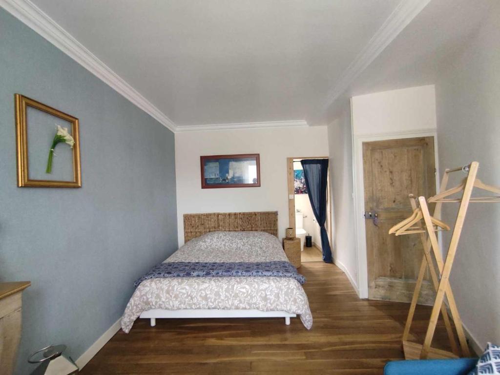 Postel nebo postele na pokoji v ubytování La Flavignienne