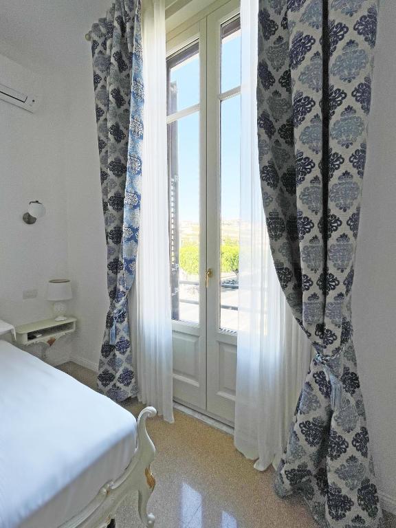 Postel nebo postele na pokoji v ubytování ISOLA - Smart ApartHotel