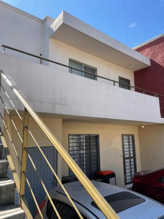 a house with a staircase in front of it at Mauricio apartment in Monterrey