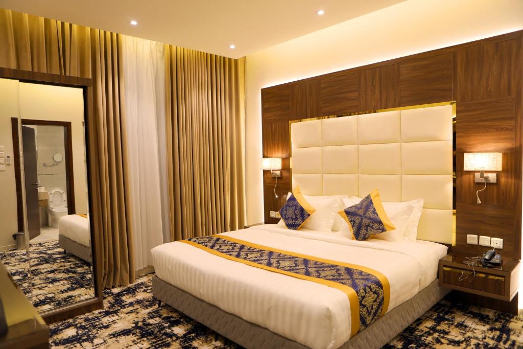 Postel nebo postele na pokoji v ubytování Oriens Hotel