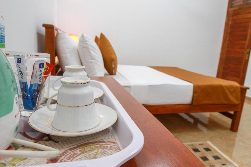 Postel nebo postele na pokoji v ubytování Hotel Nilketha Yala Tissamaharama
