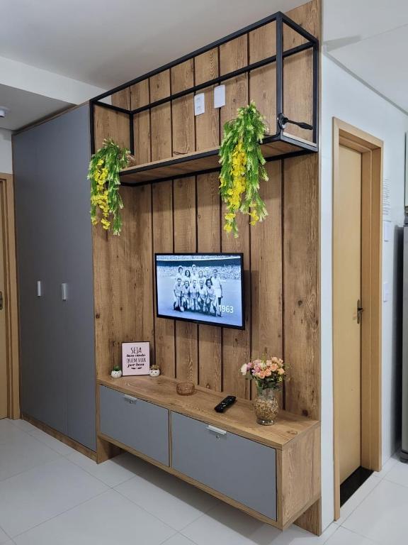 TV a/nebo společenská místnost v ubytování Lençóis Confort Residence