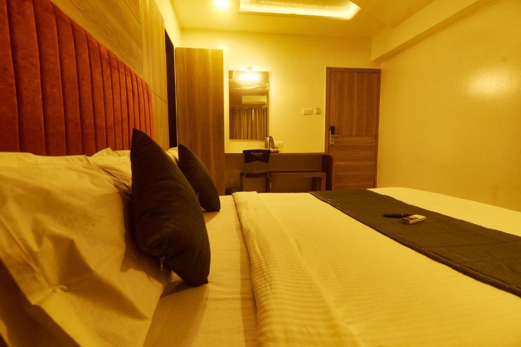 Postel nebo postele na pokoji v ubytování Hotel Anand Heritage
