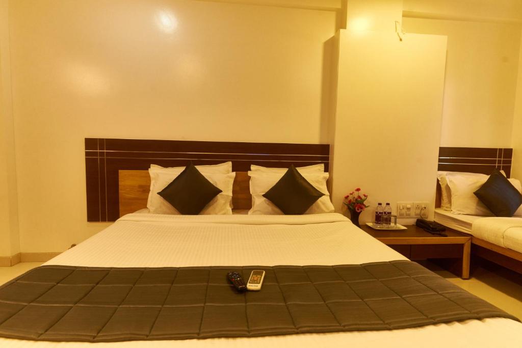 Postel nebo postele na pokoji v ubytování Hotel Anand Heritage