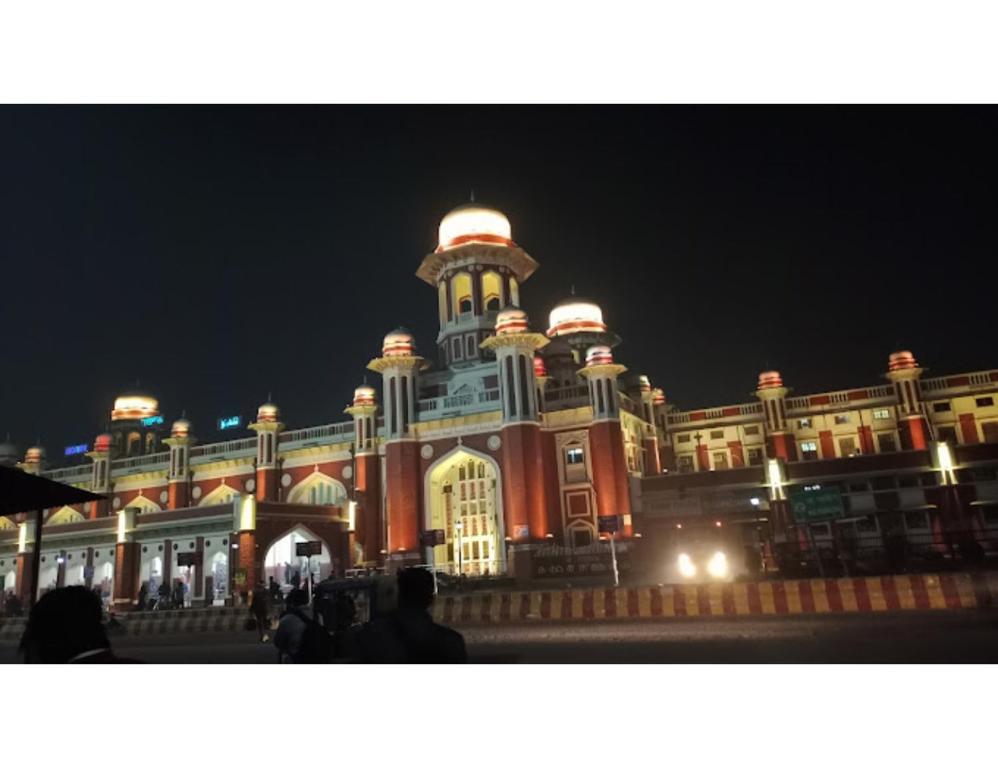 a large building with a clock tower at night at Lucknow Home Stay, Lucknow in Lucknow
