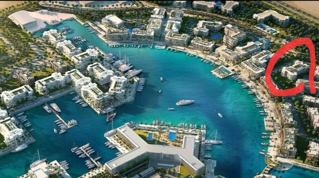 an aerial view of a harbor with a marina at Marassi Marina in El Alamein