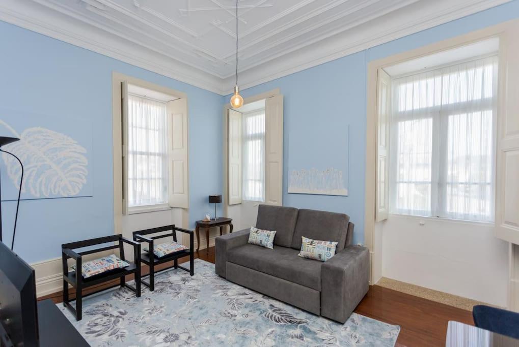 a living room with a couch and a table at 708 Mugnano House Aveleda in Vila do Conde