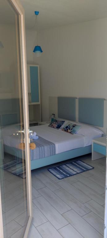 Postel nebo postele na pokoji v ubytování Hotel Pranos Turismo Rurale Cala Gonone