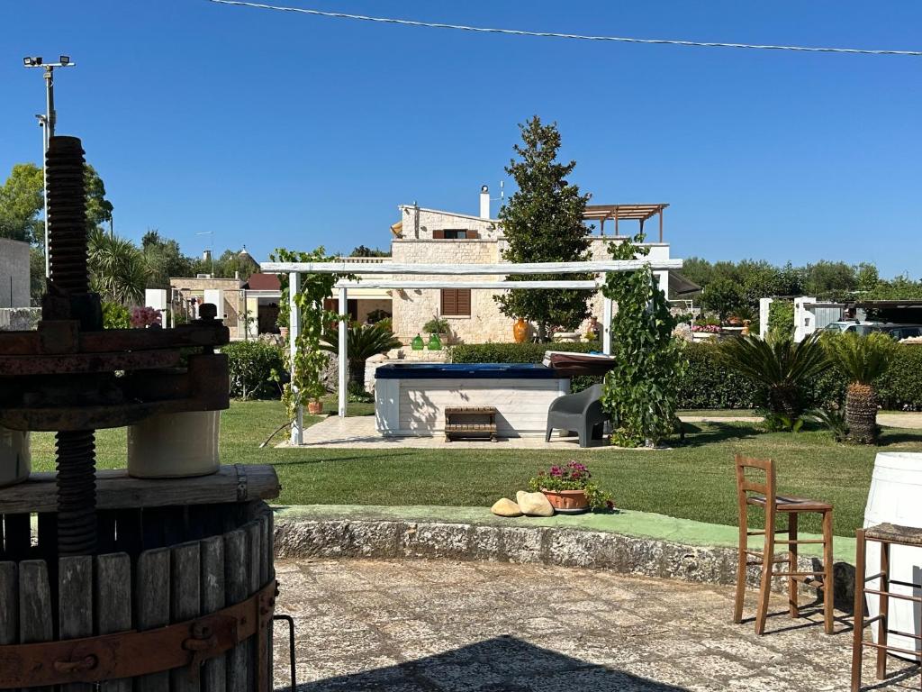a view of a house with a yard with a pool at B&B Villa Grassi in Alberobello