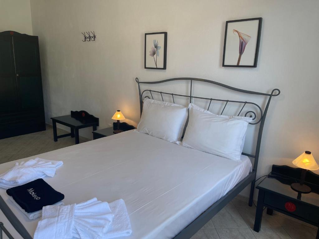 Postel nebo postele na pokoji v ubytování Venikouas Hotel