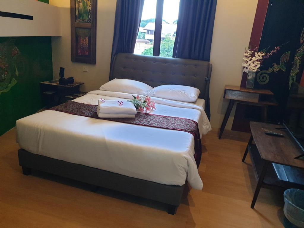 Postel nebo postele na pokoji v ubytování Fair Park Hotel