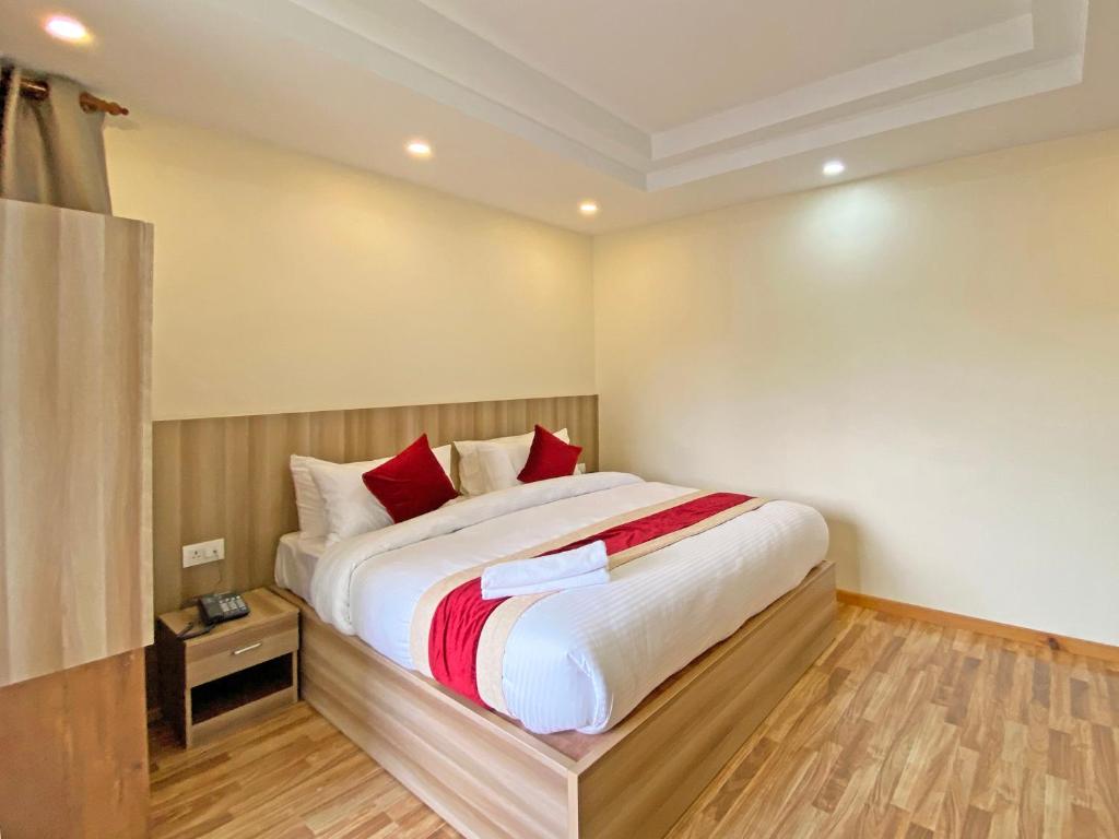 Postel nebo postele na pokoji v ubytování Hotel Royal Emperor