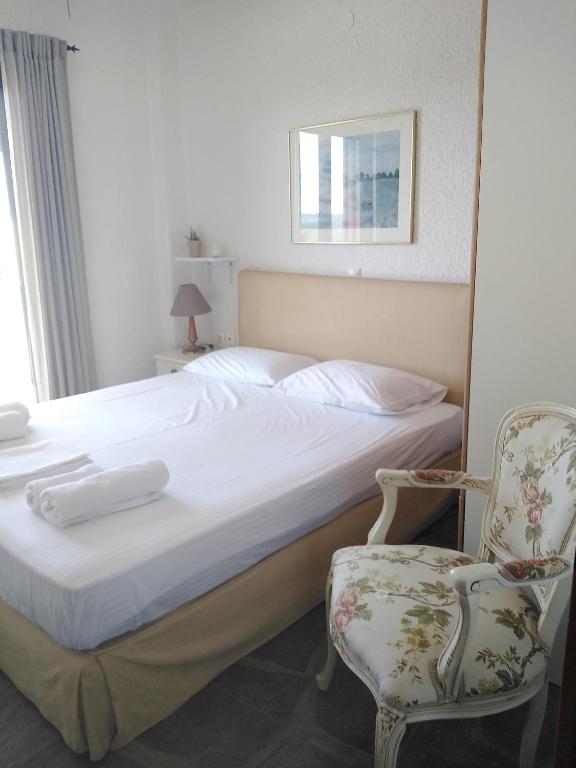 Ένα ή περισσότερα κρεβάτια σε δωμάτιο στο Rebekka's Guest House Elani