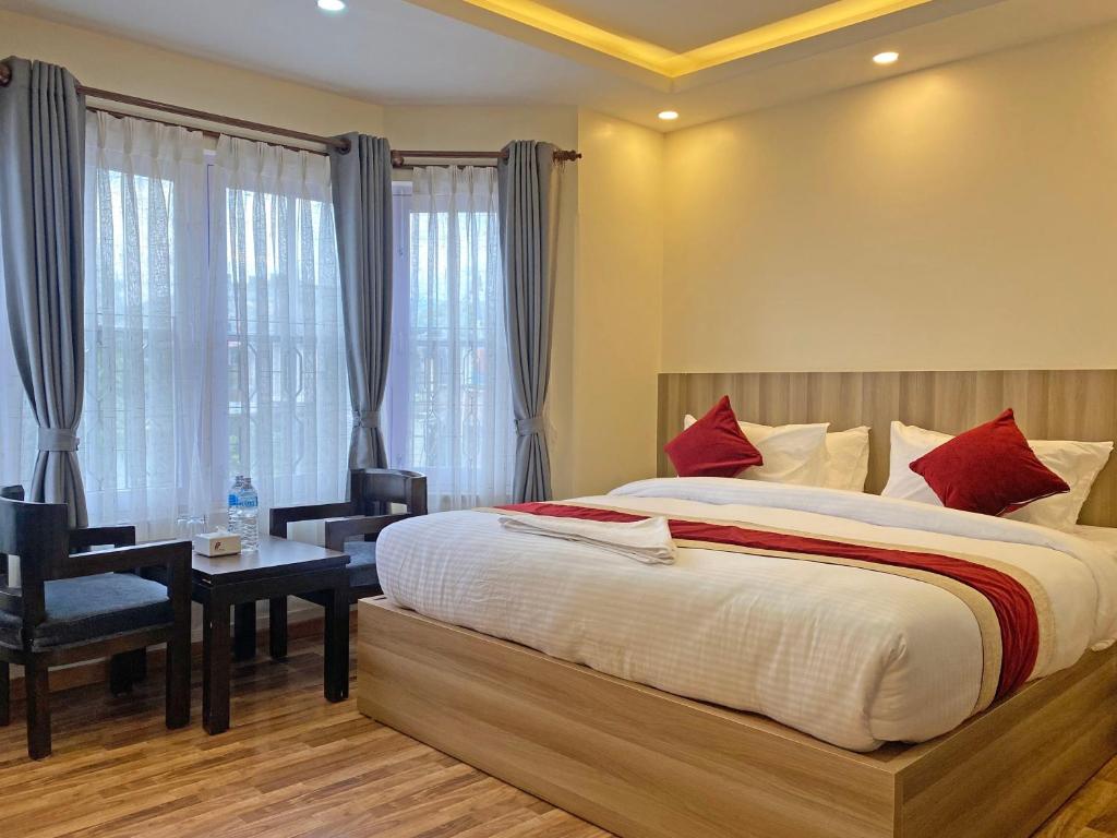 Postel nebo postele na pokoji v ubytování Hotel Royal Emperor