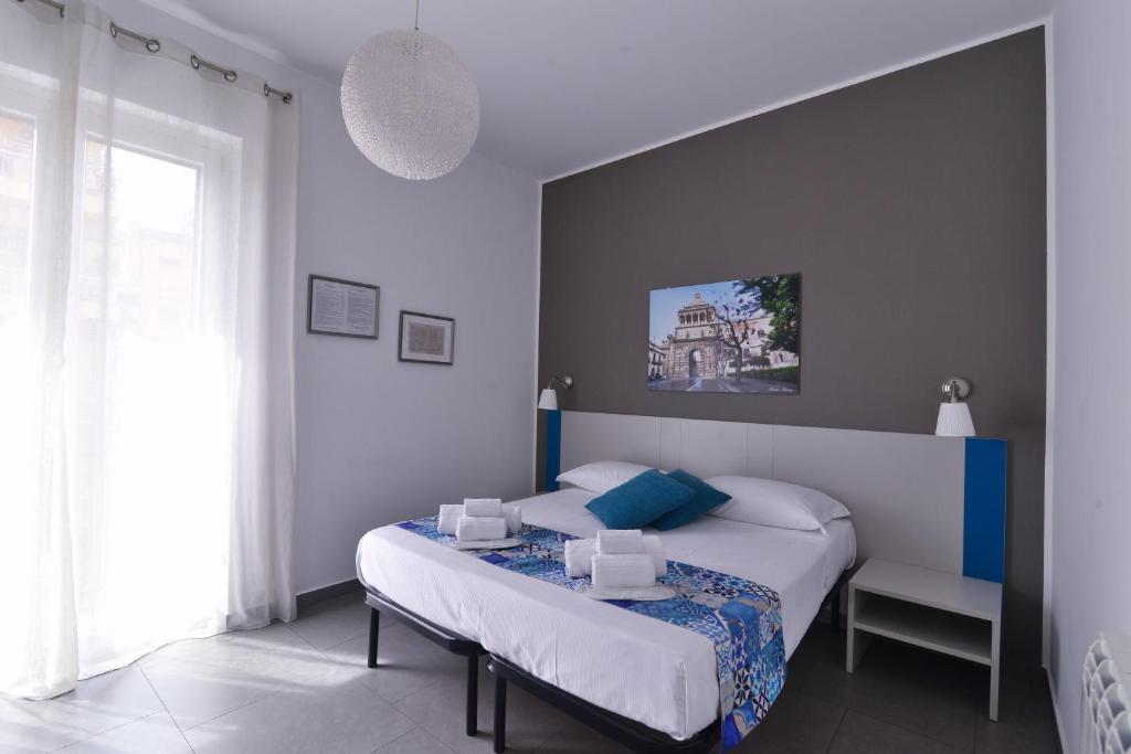Postel nebo postele na pokoji v ubytování B&B Le Porte Del Centro