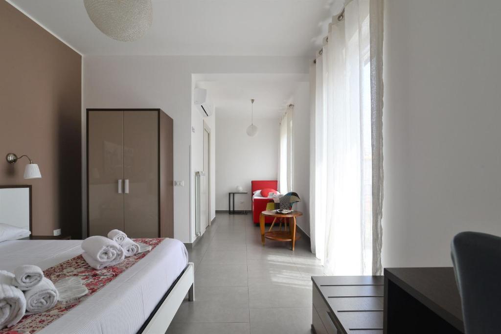 Postel nebo postele na pokoji v ubytování B&B Le Porte Del Centro
