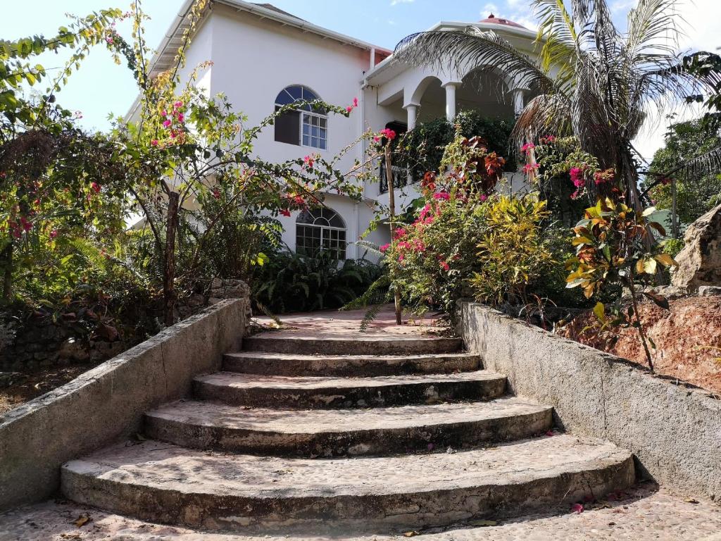 a set of stairs in front of a house at Kokojo Villa in Black River