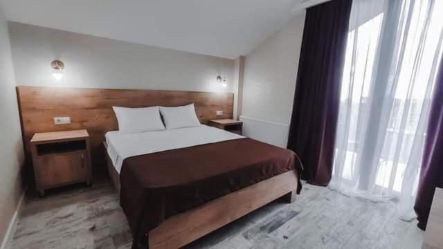 Postel nebo postele na pokoji v ubytování Villa Royal
