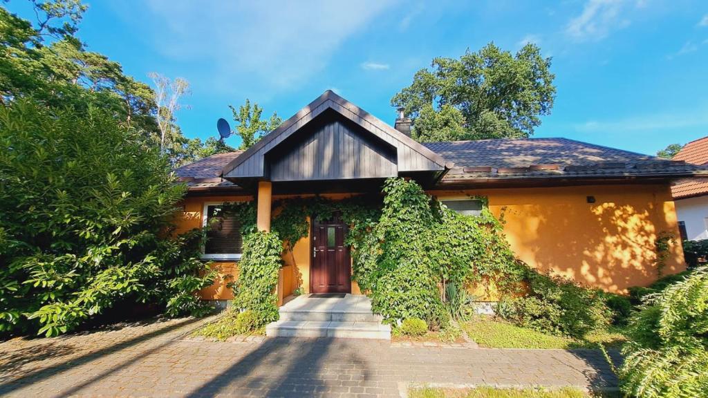 a house with a driveway leading to the front door at Pobierowo Bracka in Pobierowo